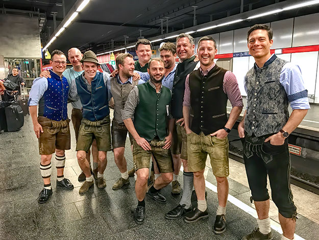 Munchner men on the way to a local festival wear traditional Lederhosen garb