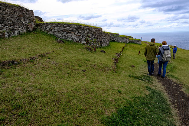 Houses at the Orongo ceremonial village were built on a narrow ledge of land between the volcano crater and the sea