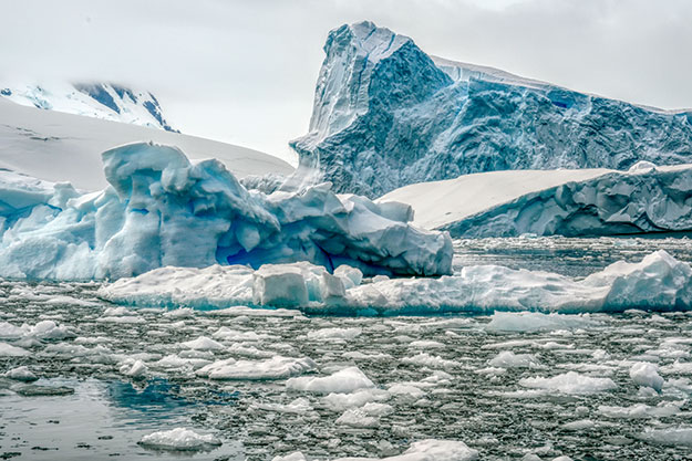 Soaring glaciers melt into sea ice at Cierva Cove, Antarctica