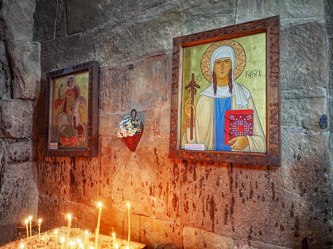 Icons inside Jvari Monastery in Mtskheta Georgia depict St. George the Dragon Slayer and Saint Nino, who brought the Holy Cross to Georgia