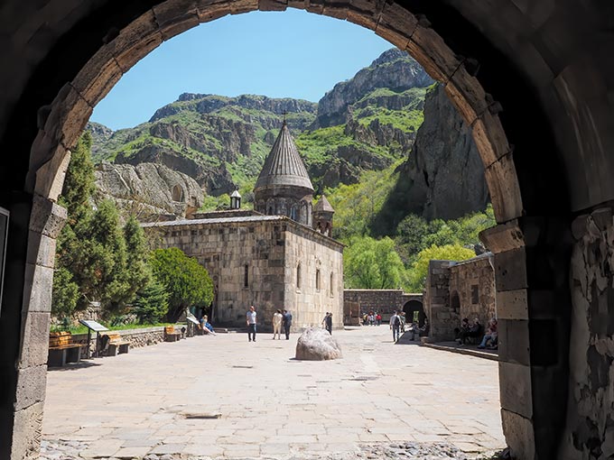 Visiting Armenia - Geghard Cave Monastery, literally carved into the solid stone mountain, is a must-see for anyone visiting Armenia
