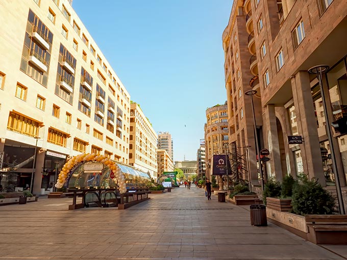 The pink volcanic tuff used in the construction of buildings on Northern Avenue in Yerevan glow in a range of colors, depending on the angle of the sun