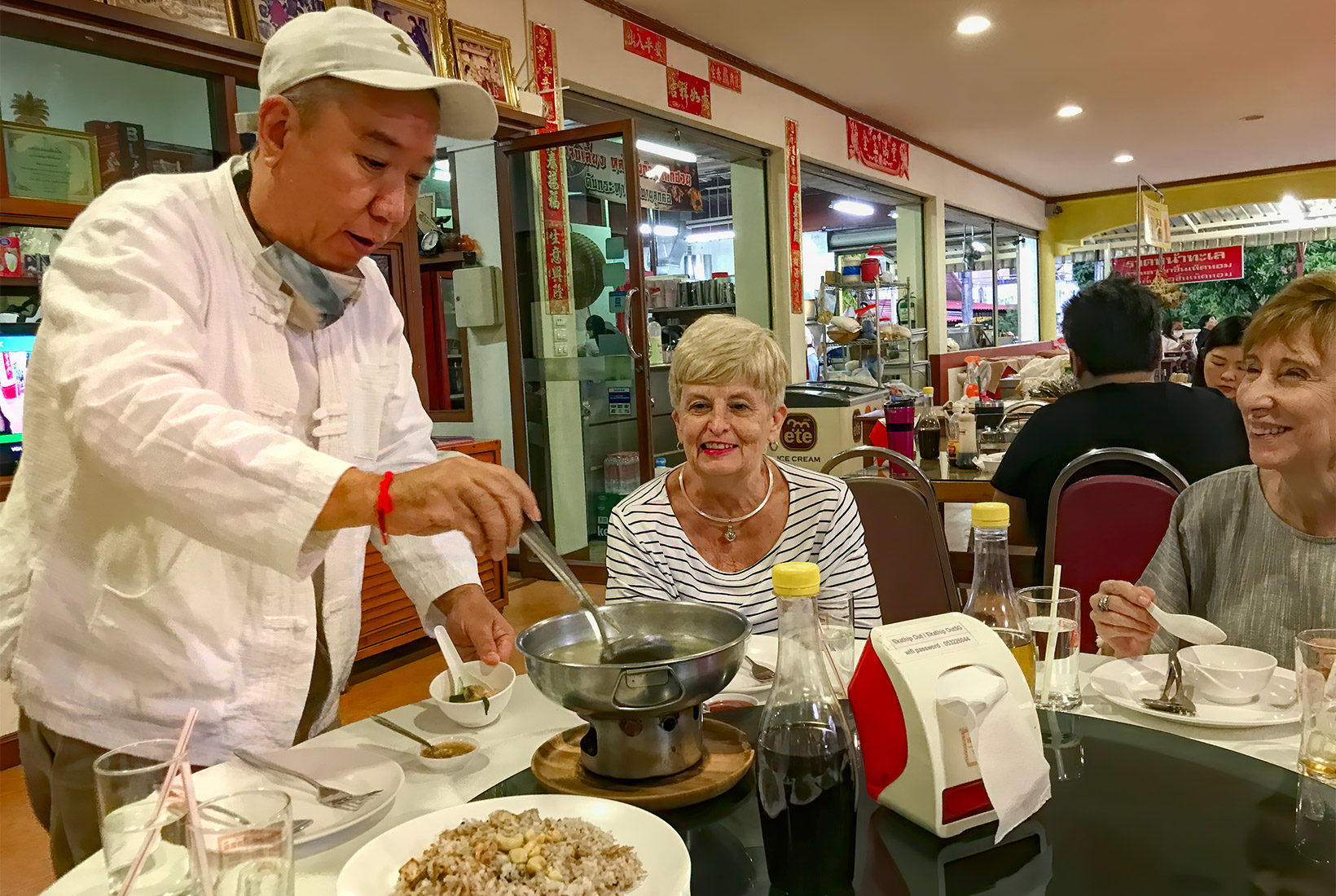 Chumpol Kondee (Pop) dishes up sweet and sour soup for us at Ekathip Chokdee Chinese Restaurant