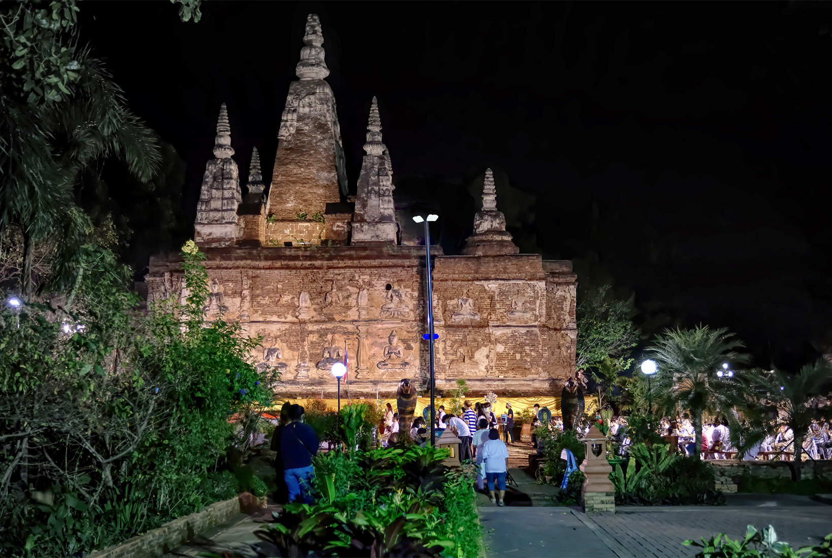 The 800-year old Viharn (worship hall) at Wat Jed Yod in Chiang Mai, Thailand. The seven spires atop its flat roof are said to have been modeled after the Mahabodhi Stupa in Bodh Gaya, India, where Buddha attained enlightenment.