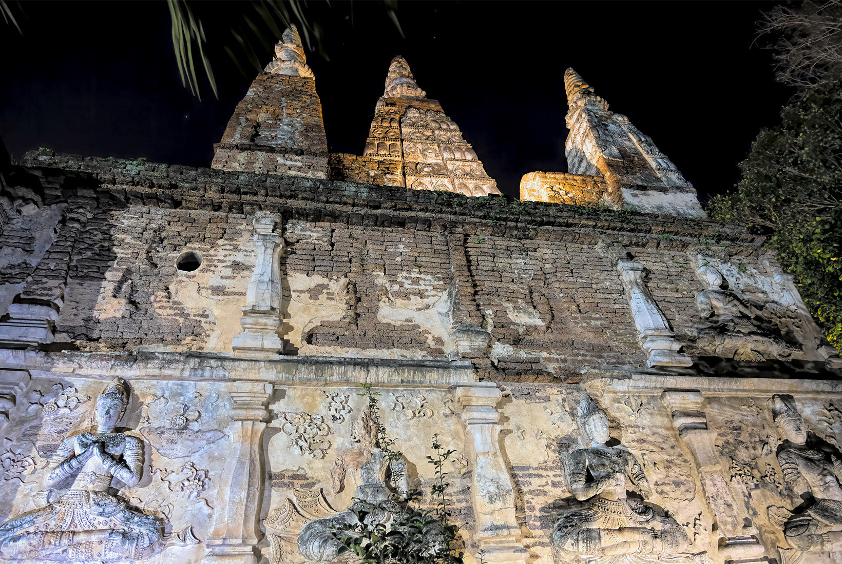 Some of the stucco carvings on the facade of the Viharn at Wat Jed Yod