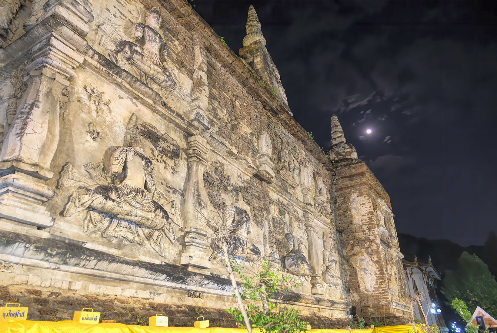 Moonrise over the 800-year old Viharn at Wat Jed Yod during the Makha Bucha Day festivities