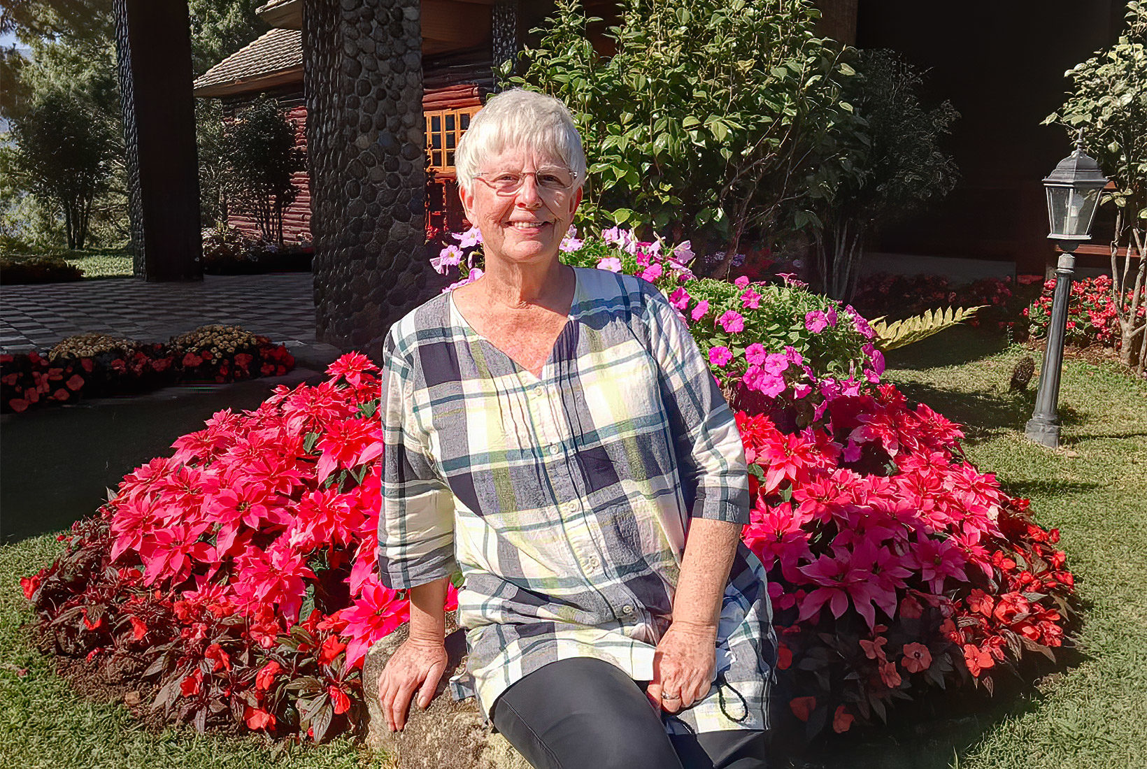 Posing in front of the manicured flower beds at Princess Sirindhorn Palace in Doi Inthanon National Park, Thailand