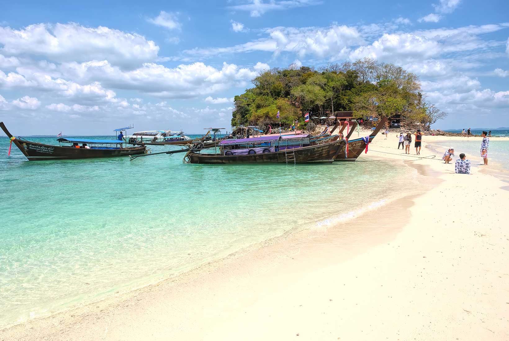 Walking the sandbar, which emerges at low tide, fro, Koh Tub island to Koh Mo island