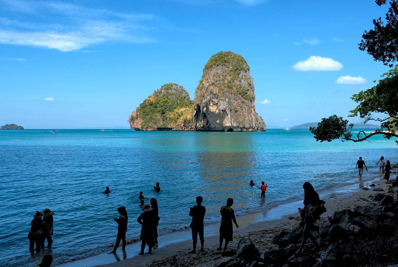 Railay Beach Krabi Thailand, a couple of men and woman on the