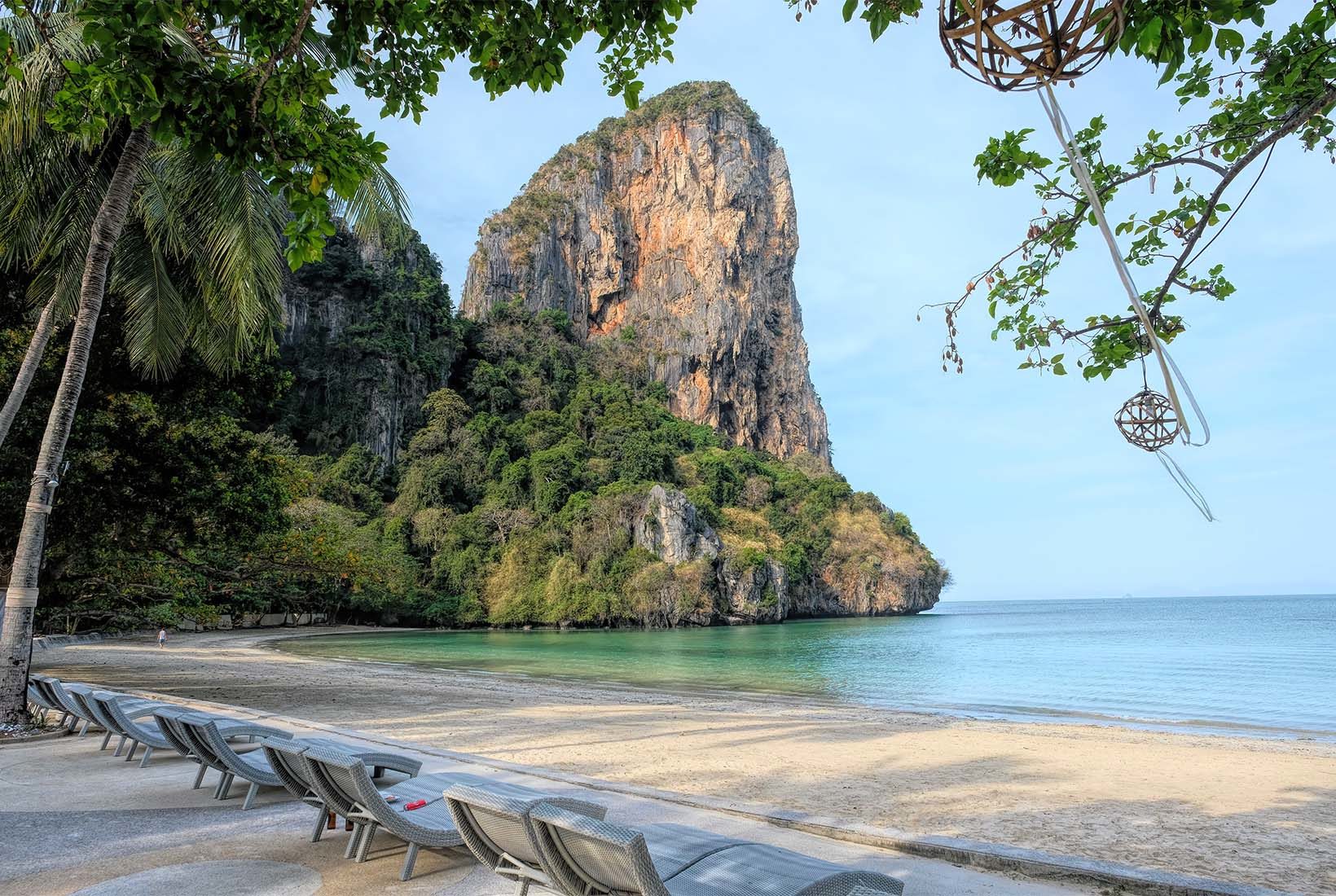 Karst limestone formations bracket both ends of lovely Railay Beach West