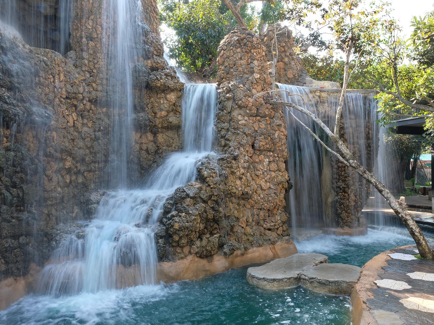 Waterfall near the entrance of Dantewada Waterfall Park provides a stunning backdrop for the coffee shop