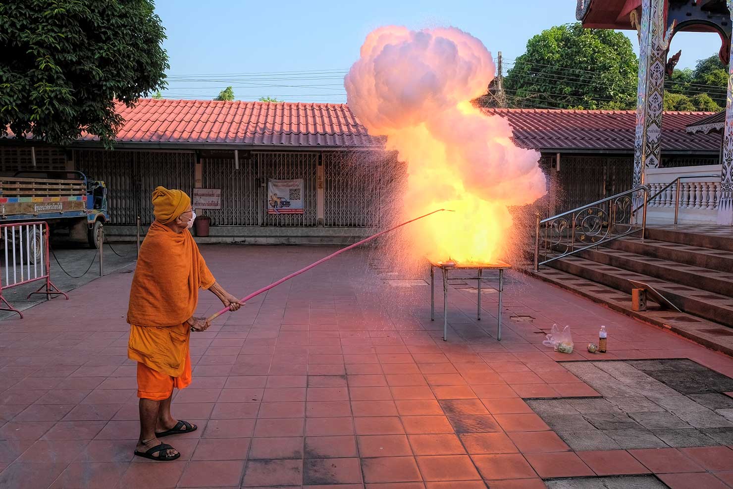 Crackle-Bam! The cremains go up with a flash in this most unusual Buddhist funeral