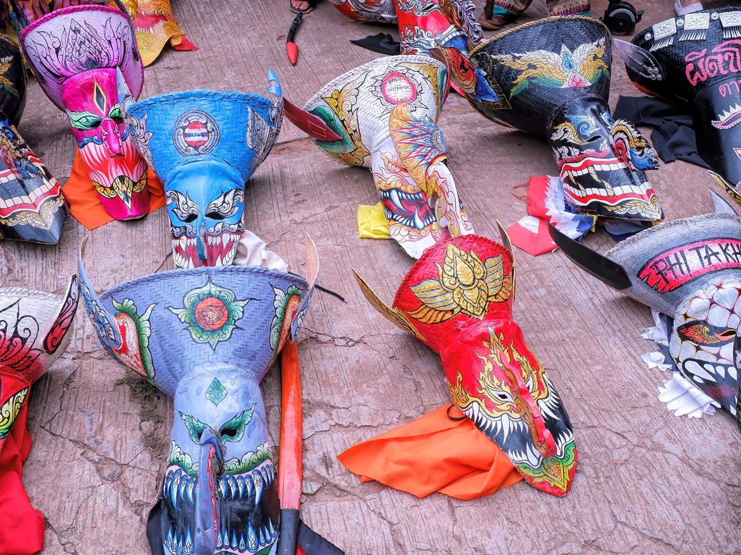 Phi ta Khon masks displayed in the courtyard at Wat Phon Chai in Dan Sai