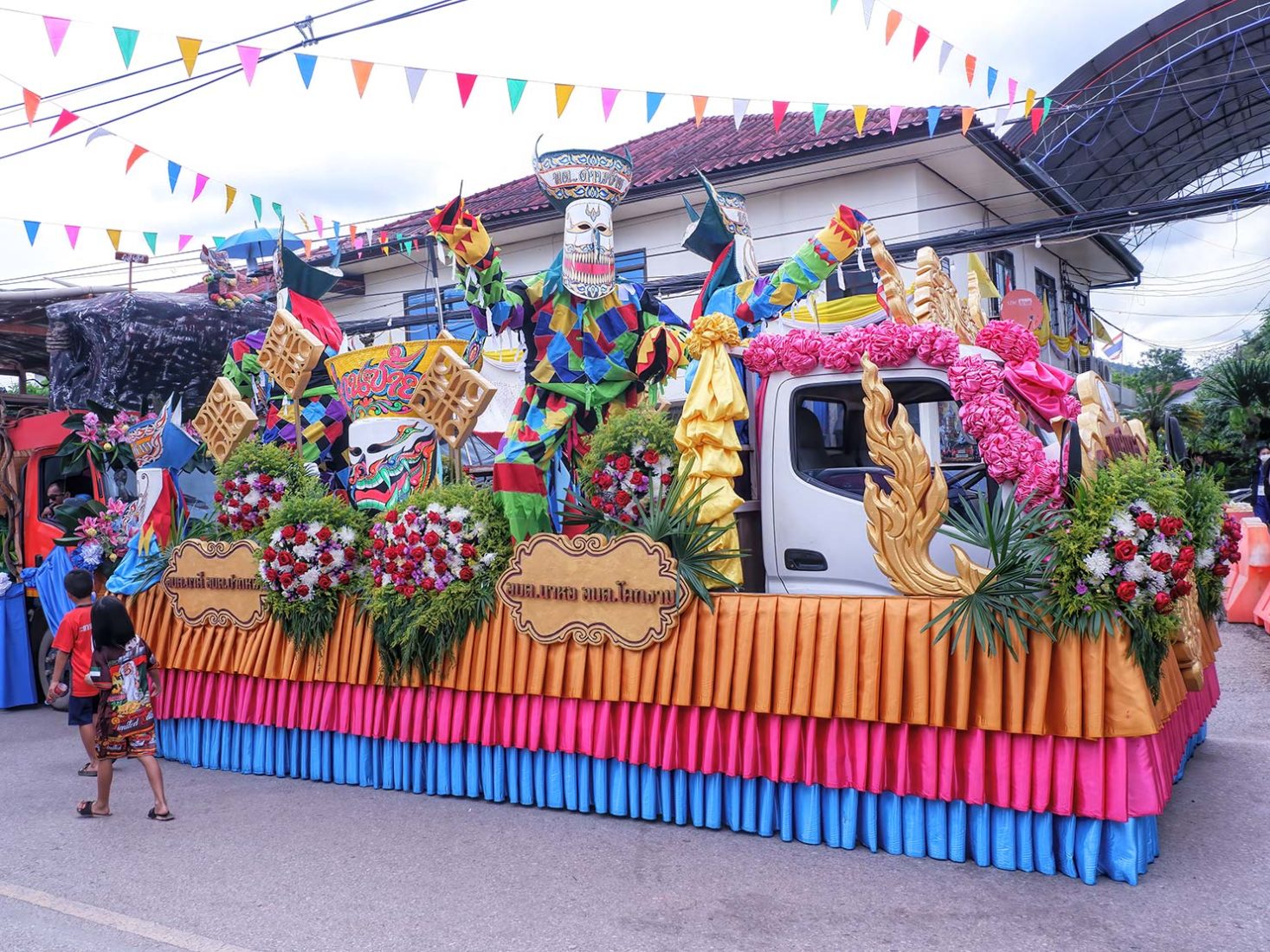 Another float awaits the start of the festival's parade