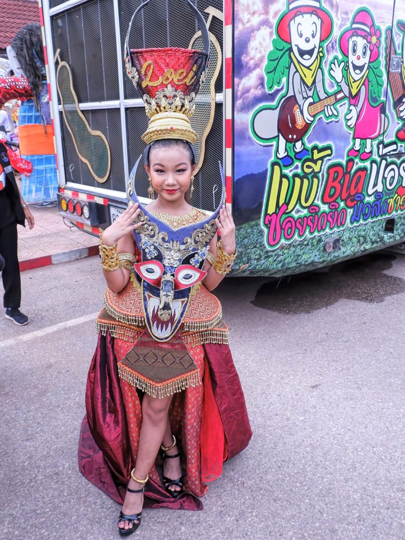 Young girl awaits her turn to perform at Phi ta Khon Festival