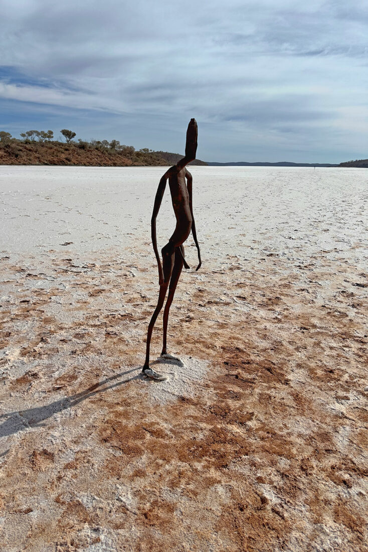 One of 51 Antony Gormley sculptures stands on the salt flats of Lake Ballard in Menzies Western Australia