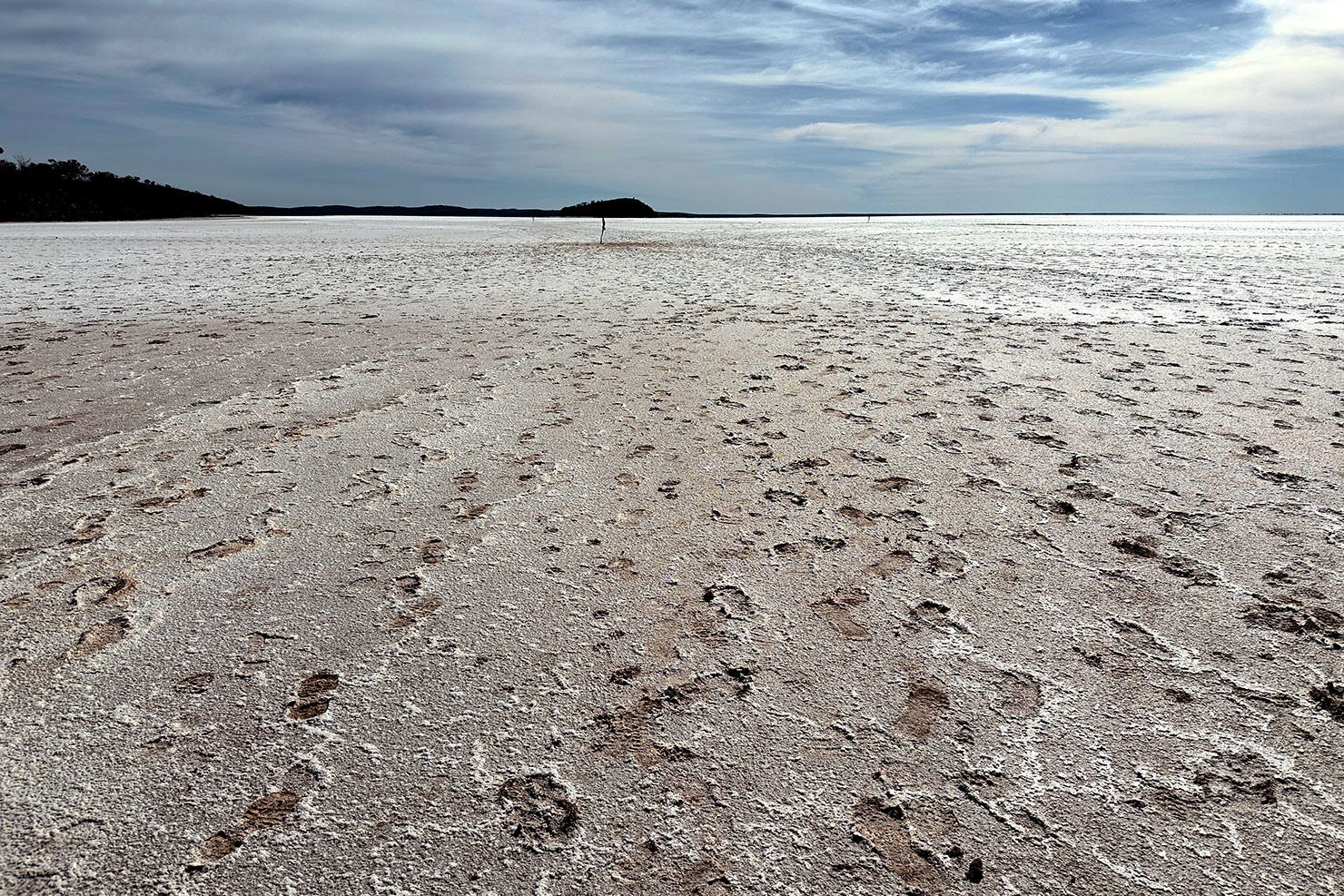 Antony Gormley sculptures stretch across the red dirt and salt flats of Lake Ballard