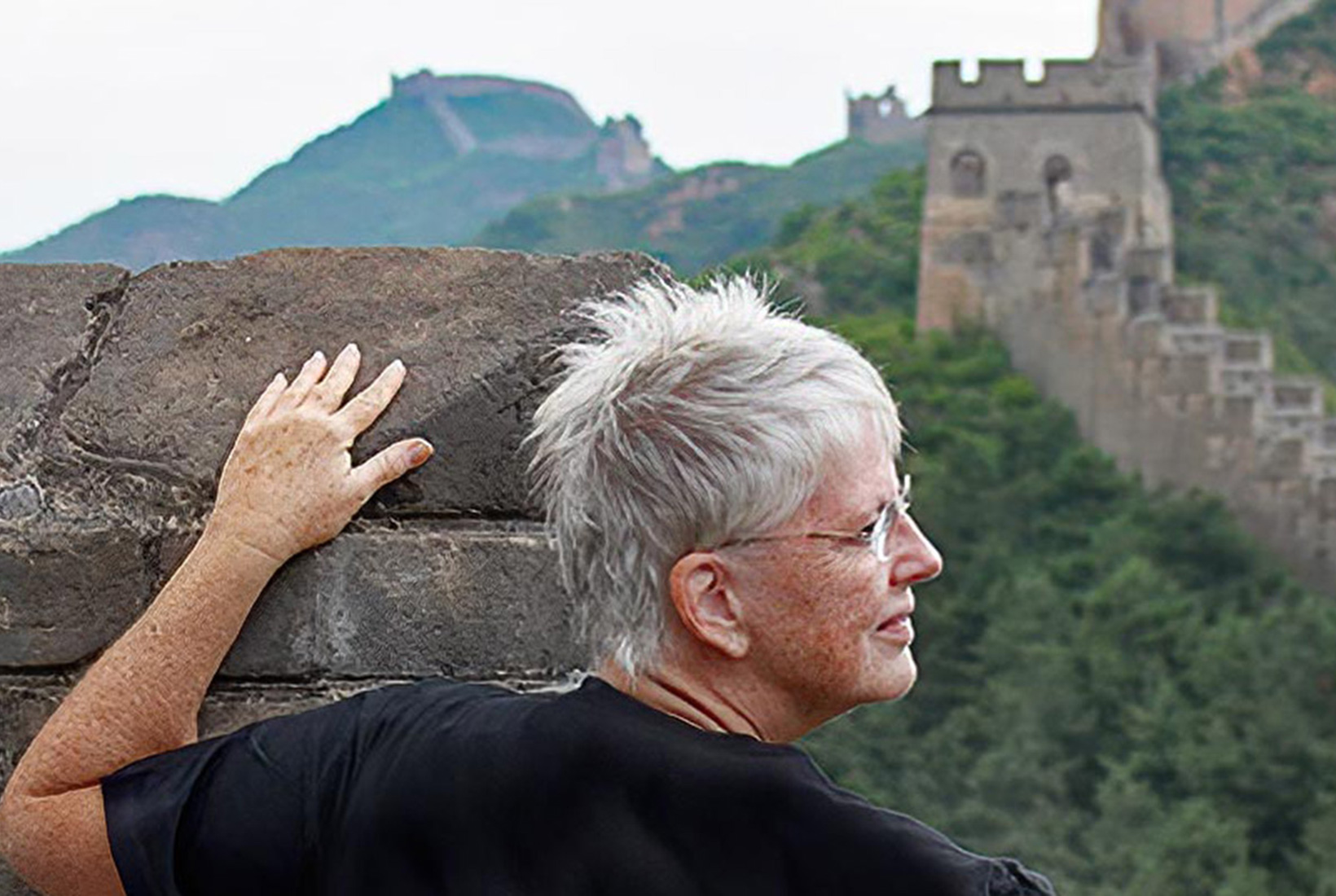 Barbara Weibel atop the Great Wall of China in the Jinshanling District, where she was allowed to camp overnight