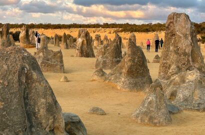 The main field of pinnacles is in the foreground, while the a scattering of smaller pinnacles is seen in the background, on a small dune that is perfect for viewing the sunset