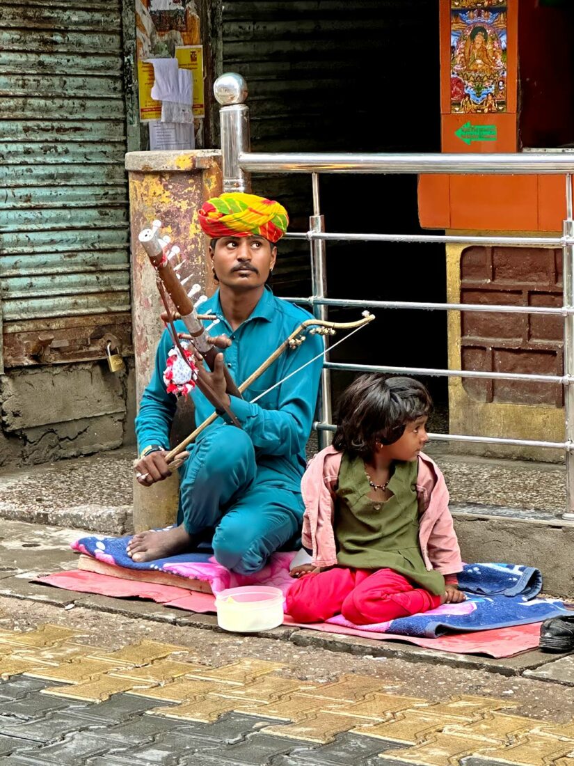 Musician earns a living playing on the street in front of the Kalachakra Temple in McLeod Ganj India