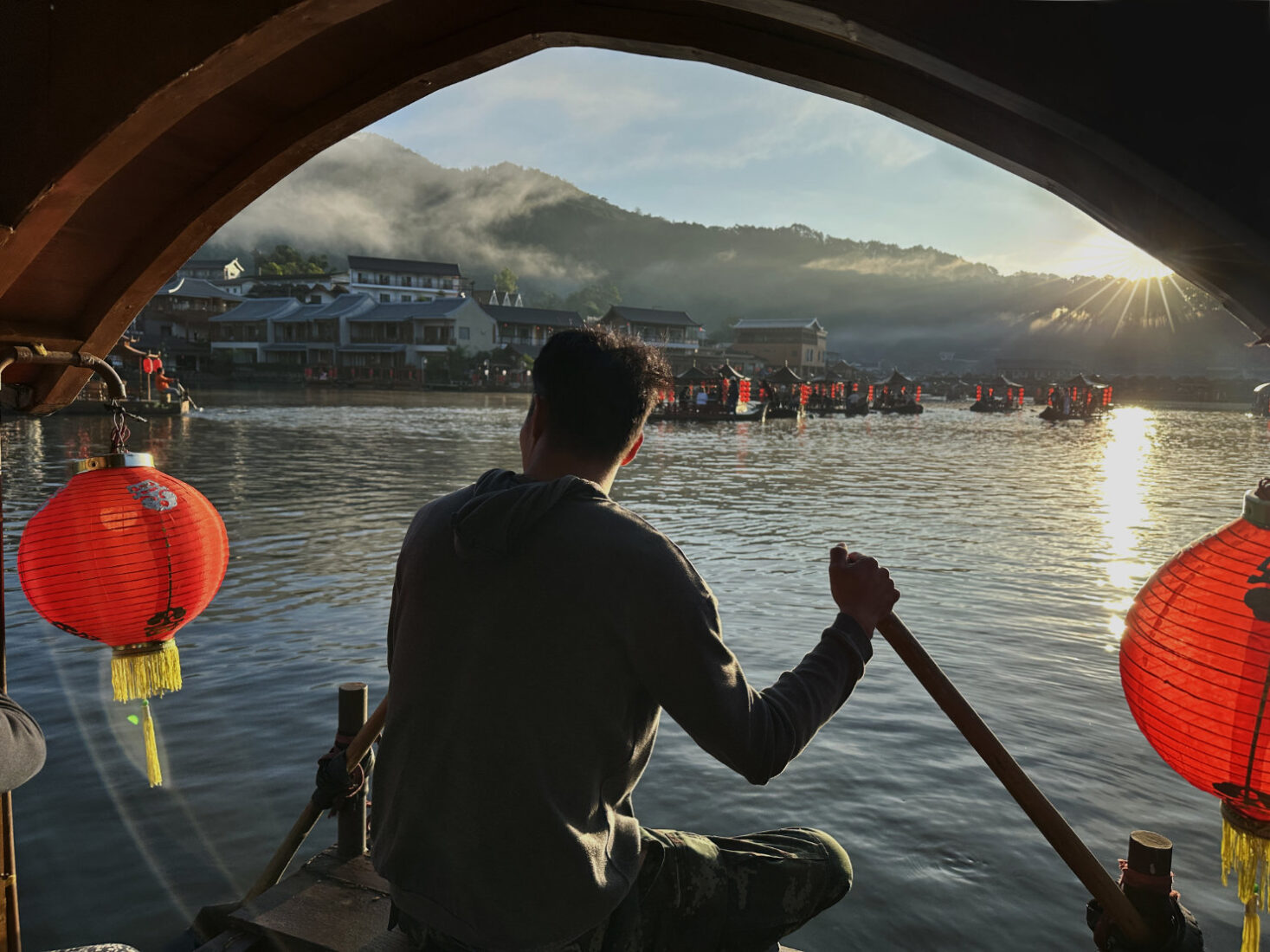 Dawn boat ride on the lake at Ban Rak Thai Chinese village in far northern Mae Hong Son Province Thailand